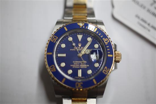 A gentlemens stainless steel and yellow gold Rolex Oyster Perpetual Date Submariner wrist watch,